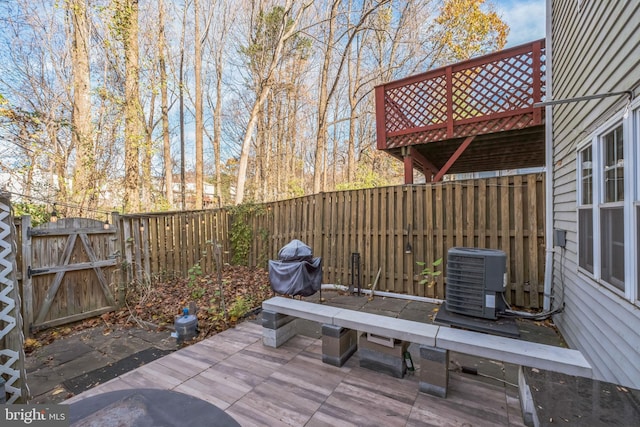 wooden terrace featuring central air condition unit