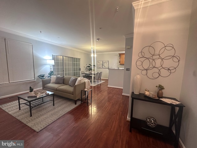 living room with dark hardwood / wood-style flooring and ornamental molding