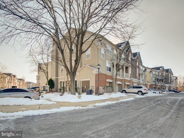 snow covered building featuring central AC