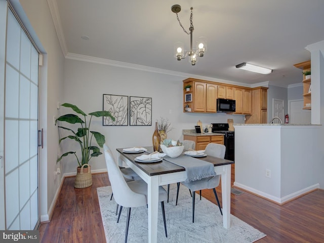 dining room with a notable chandelier, dark hardwood / wood-style floors, and crown molding