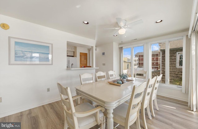 dining room featuring light wood-type flooring and ceiling fan