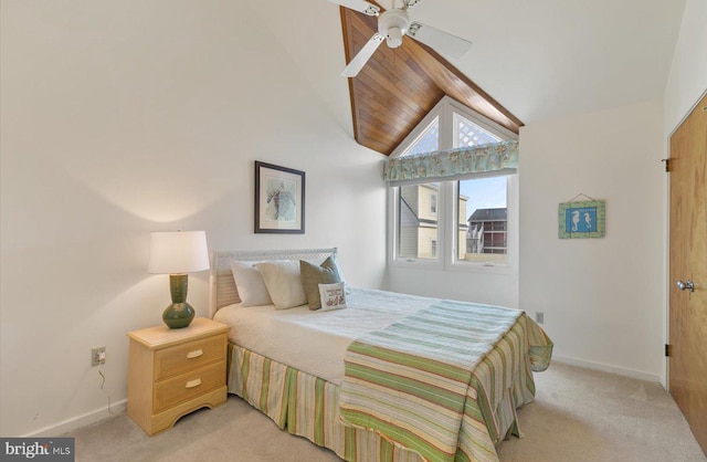 carpeted bedroom featuring ceiling fan and lofted ceiling