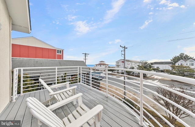 wooden terrace with a water view