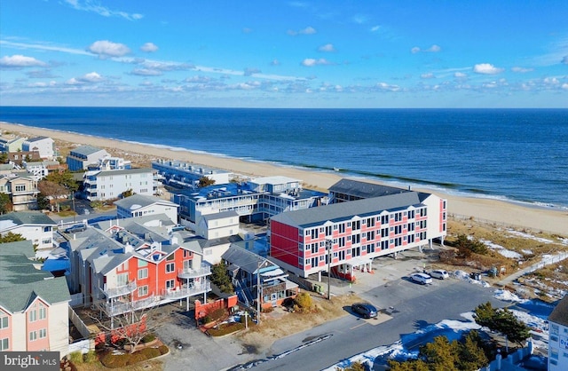 bird's eye view featuring a water view and a view of the beach