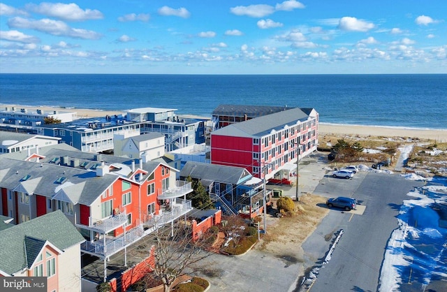 drone / aerial view with a water view and a view of the beach