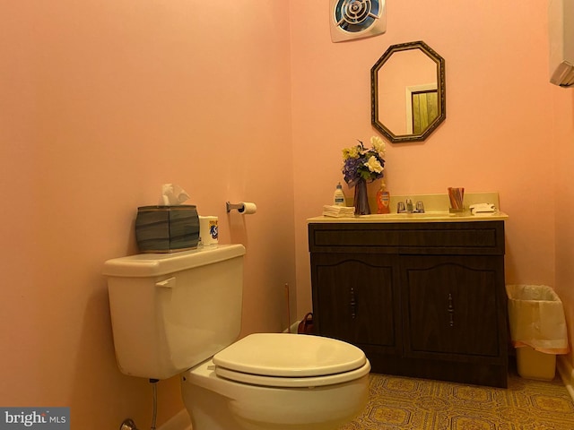 bathroom with tile patterned floors, vanity, and toilet