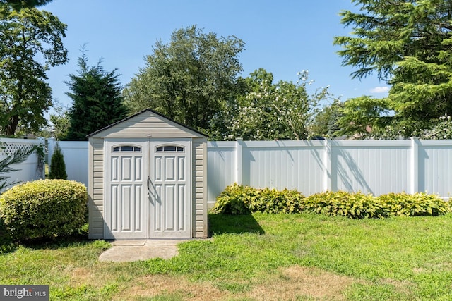 view of outdoor structure with a lawn