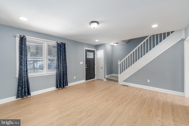 foyer entrance with light hardwood / wood-style flooring