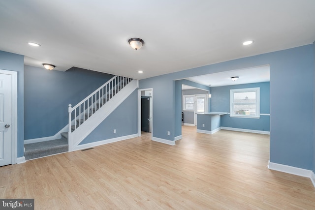 unfurnished living room featuring light hardwood / wood-style flooring