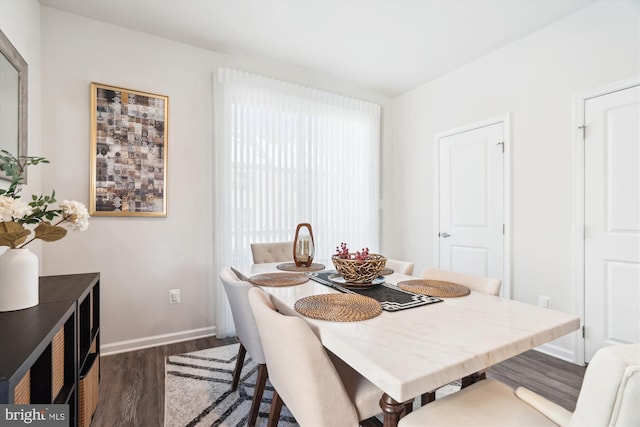 dining area with dark wood-type flooring