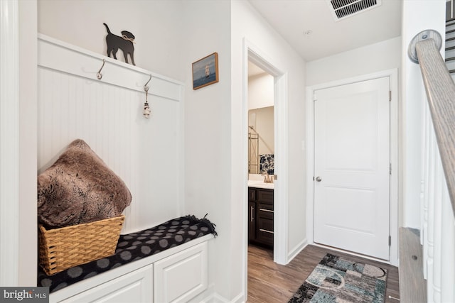 mudroom with light hardwood / wood-style floors