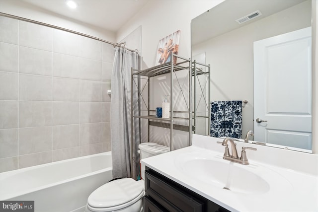 full bathroom featuring shower / tub combo with curtain, vanity, and toilet