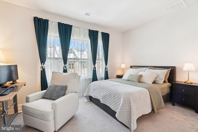 bedroom with light colored carpet