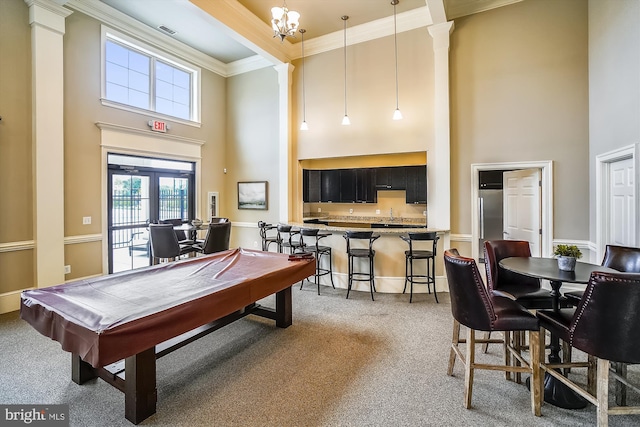 rec room with french doors, a towering ceiling, ornamental molding, pool table, and carpet floors