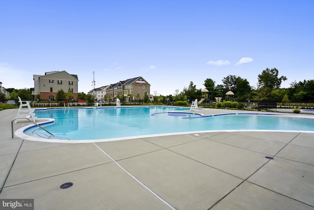 view of swimming pool with a patio area