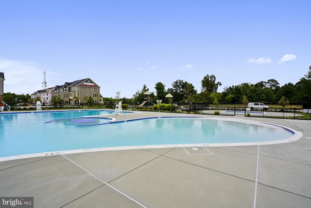 view of swimming pool featuring a patio