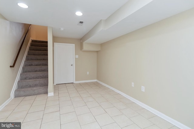 basement with light tile patterned flooring