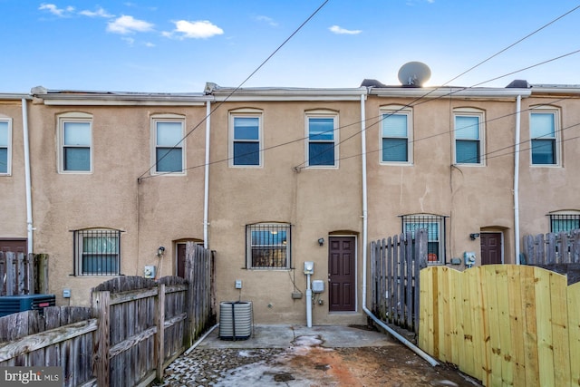 back of property with central air condition unit