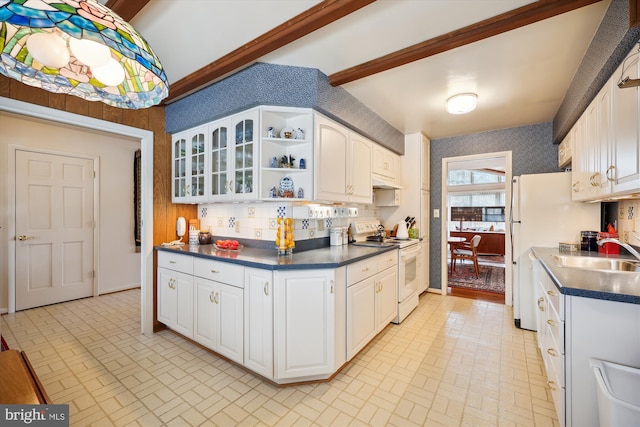 kitchen featuring sink, white cabinetry, white appliances, and beamed ceiling