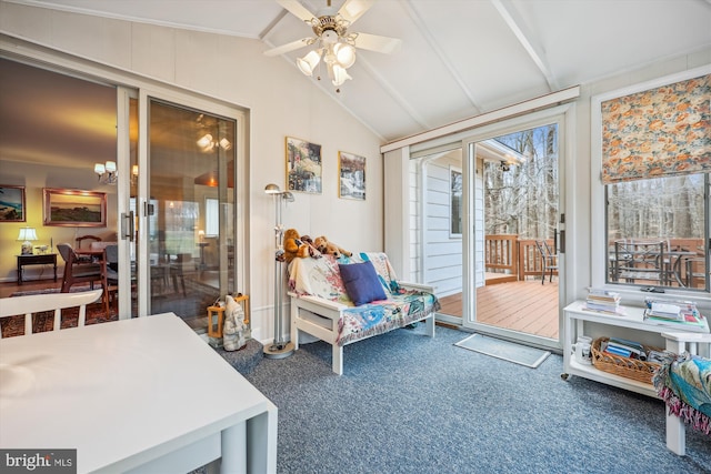 sunroom / solarium with lofted ceiling, ceiling fan, and a wealth of natural light