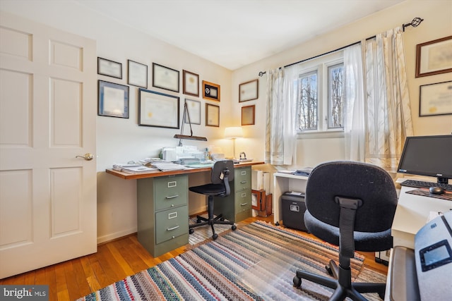 home office featuring hardwood / wood-style floors