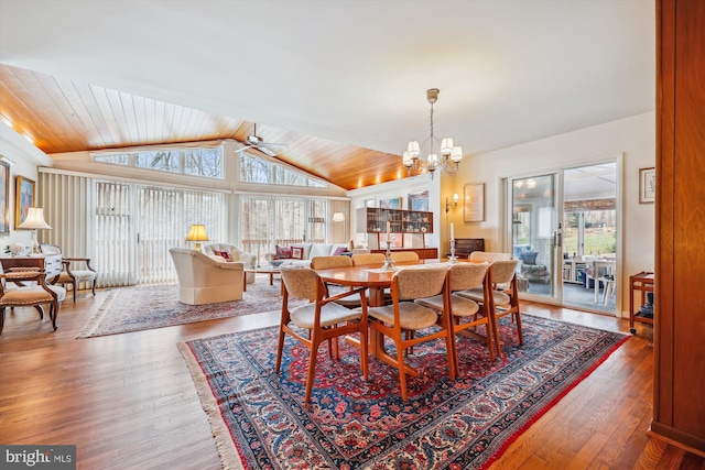 dining room featuring hardwood / wood-style flooring, ceiling fan with notable chandelier, wood ceiling, and vaulted ceiling