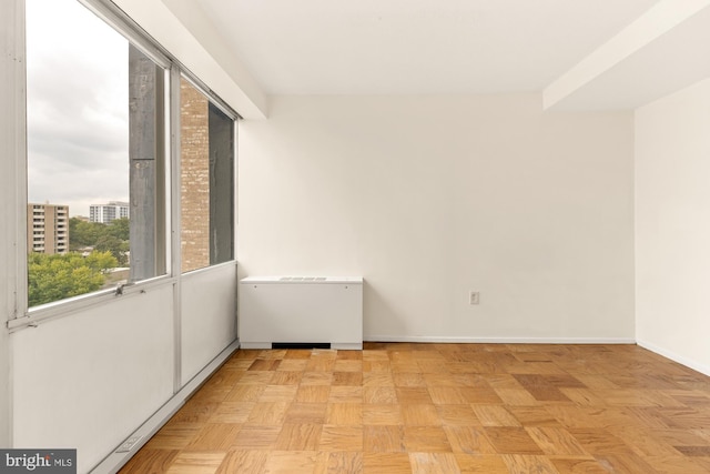 empty room with light parquet flooring