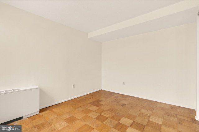 spare room featuring light parquet flooring