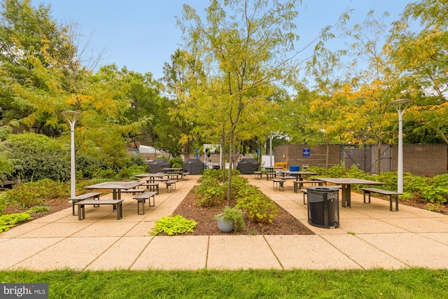 surrounding community with a patio area