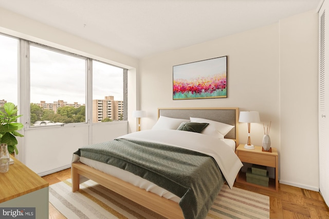 bedroom with a closet and parquet floors