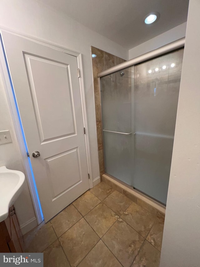 full bath featuring a shower stall