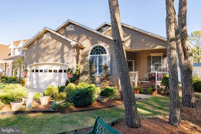 view of front of home with covered porch and a garage