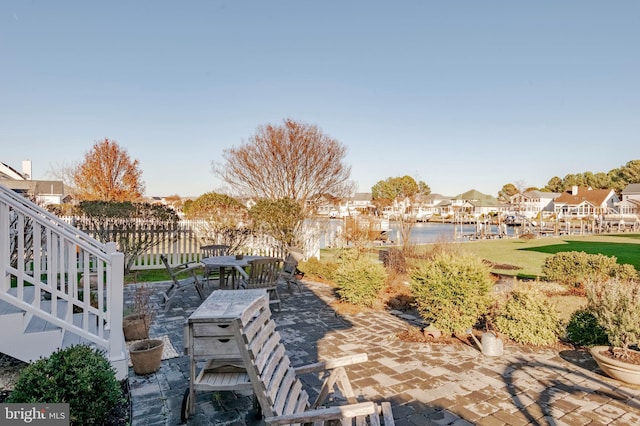 view of patio featuring a water view