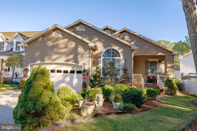 view of front of house with a porch and a garage