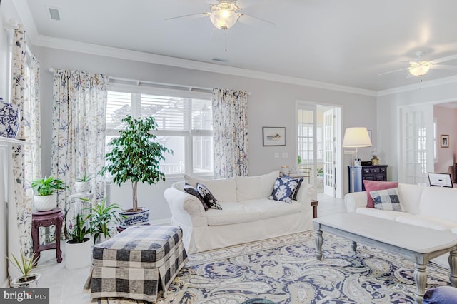 living room featuring ceiling fan and ornamental molding