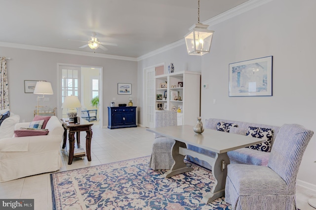 dining room featuring ceiling fan with notable chandelier, light tile patterned flooring, breakfast area, and crown molding