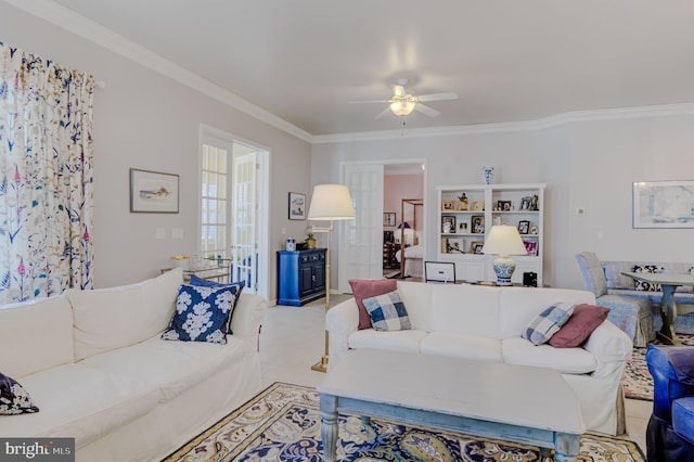 living room featuring ceiling fan and crown molding