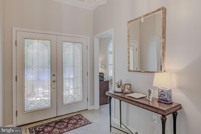 tiled entryway featuring french doors