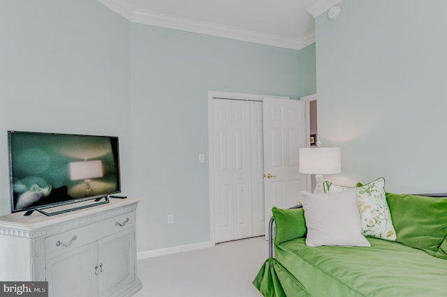 bedroom with light carpet, a closet, and crown molding