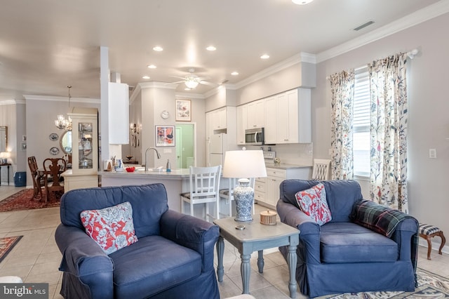 living room with ceiling fan with notable chandelier, ornamental molding, and light tile patterned floors