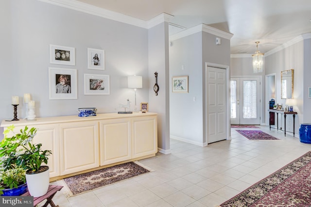 entrance foyer with french doors, ornamental molding, and light tile patterned floors