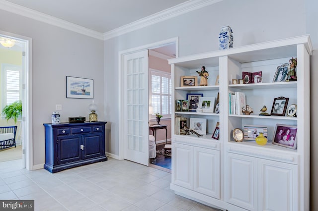 interior space with french doors, ornamental molding, light tile patterned floors, and a healthy amount of sunlight