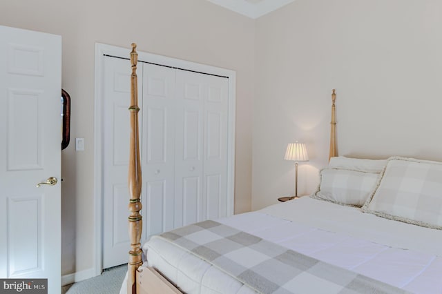 carpeted bedroom with a closet