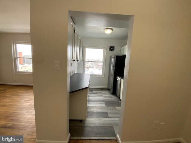 hallway with light wood-type flooring