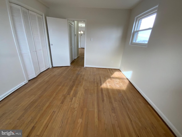 unfurnished bedroom with light wood-type flooring