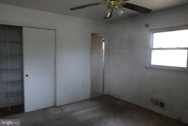 unfurnished bedroom with ceiling fan, a closet, and carpet floors