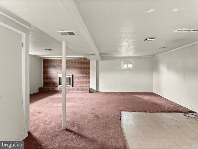 7107 Dower House Rd, Upper Marlboro, MD 20772 - basement with a fireplace, carpet, and a textured ceiling