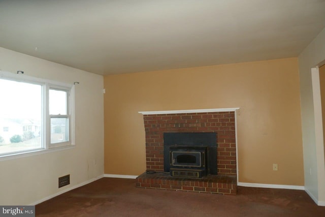 unfurnished living room with dark carpet