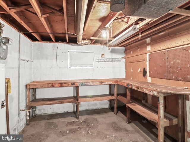 7107 Dower House Rd, Upper Marlboro, MD 20772 - unfinished basement featuring a workshop area and concrete block wall