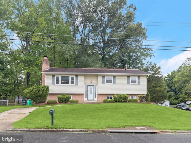 7107 Dower House Rd, Upper Marlboro, MD 20772 - split foyer home with a chimney and concrete driveway